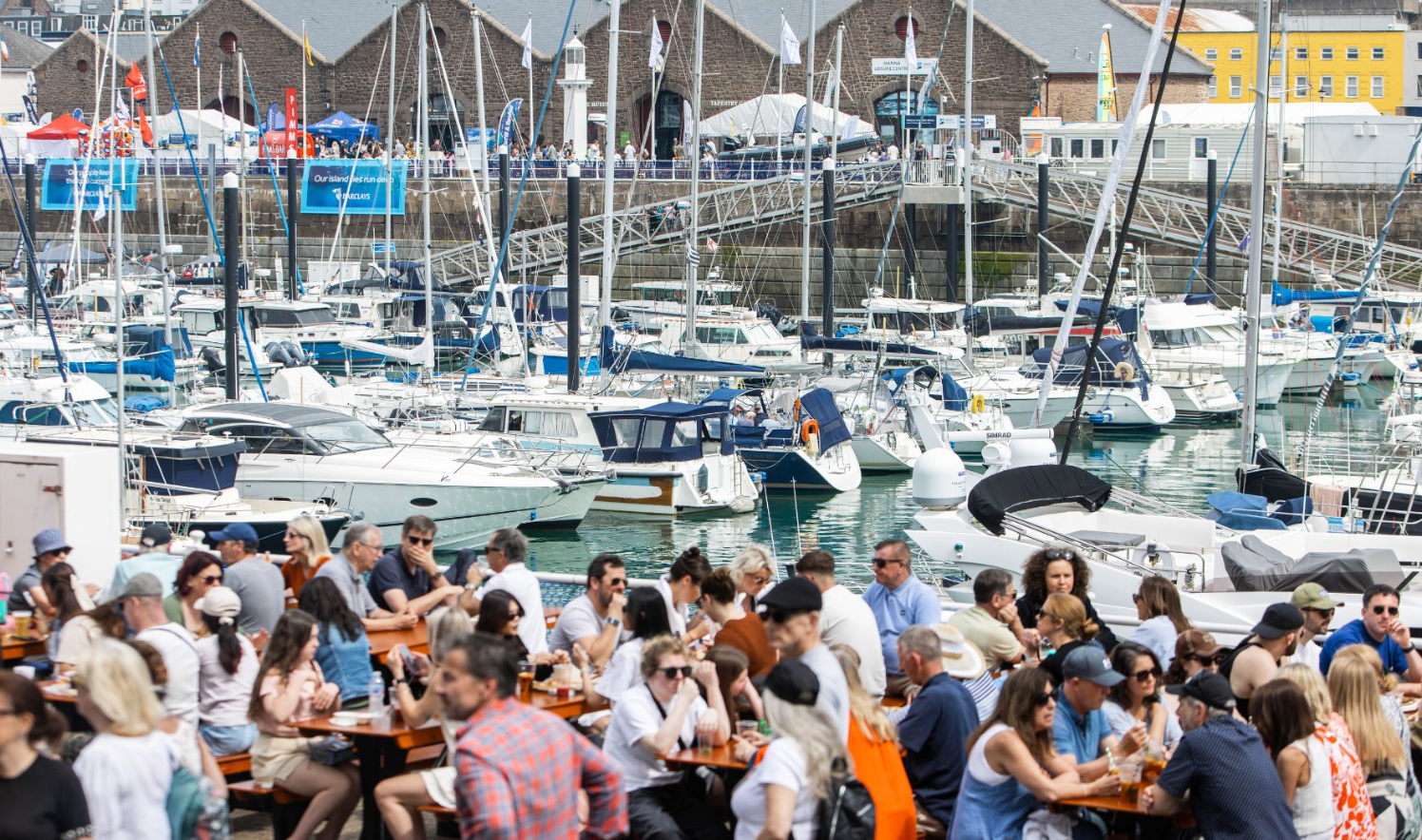 Crowd enjoying a Jersey festival at St Helier marina